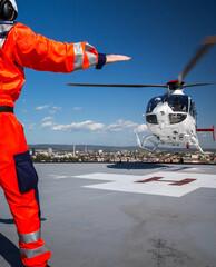 Modern medical helicopter on a hospital rooftop helipad
