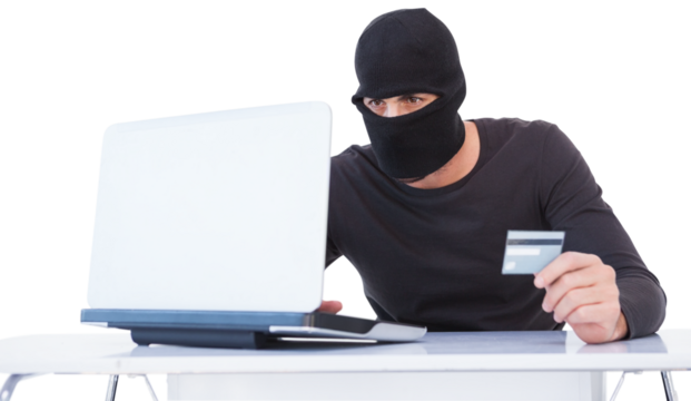 Burglar doing online shopping with laptop and credit card - Powered by Adobe