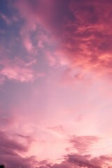 Fototapeta premium a pinkish sunset with clouds on high octane backgrounds
