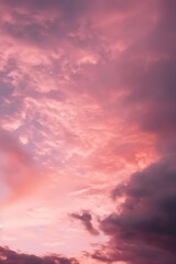 Fototapeta premium some clouds are over a pink sky