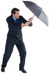 Man holding umbrella to protect himself from the rain