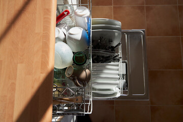 High angle view of dishes and utensils in a dishwasher
