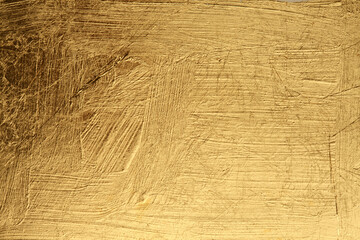 Grunge Gold and bronze glitter color smear painting wall. Abstract glow shine background.