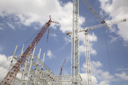 Cranes and Frame of Building at Construction Site