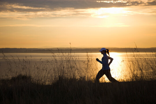 Woman Running near Puget Sound, Seattle, Washington, USA