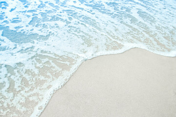 Fototapeta na wymiar A Beautiful sea and sand on the shore vacation travel background
