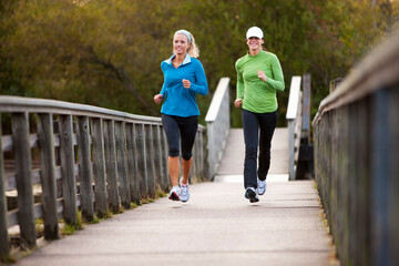 Two Women Jogging through Park