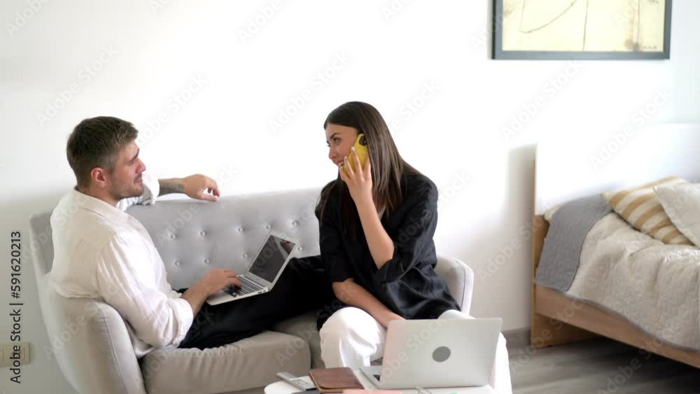Poster caucasian female using cellphone device for discussing startup ideas during remote working with husb