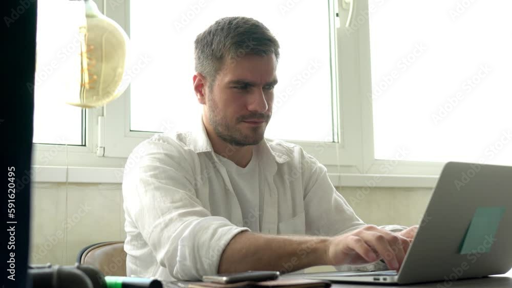 Poster skilled it professional checking received notification on smartphone device while doing distance web