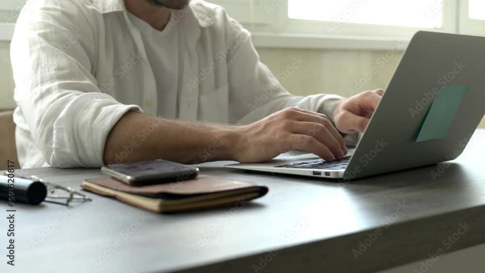 Poster millennial male using booking application for making online banking on modern laptop technology, ski