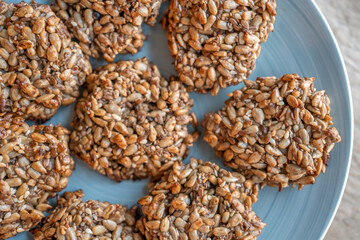 Vegan cookies made of banana and different seeds, photographed with natural light