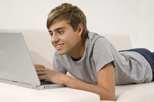 Teenage Boy Using Laptop