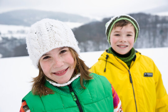 Portrait of Two Children Outdoors in Winter