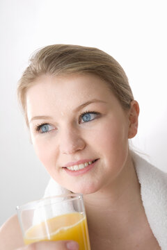Close-Up of Sweaty Woman with Glass of Juice