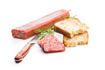 Smoked sausage. Sliced salami and bread isolatd on white background.