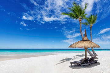 Sunny white sand beach with coconut palm trees, straw umbrella and turquoise sea. Summer vacation and tropical beach concept.	