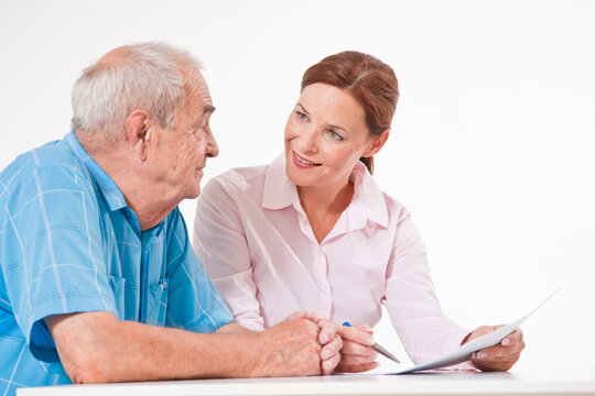 Man and Woman Discussing Paperwork