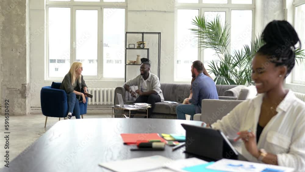 Poster happy dark skinned graphic designer connecting to coworking internet on digital tablet for creating 