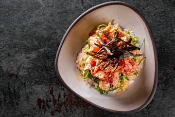 shrimp poke with rice and vegetables in bowl