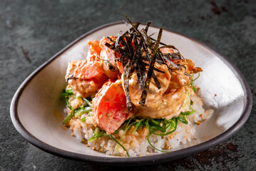 shrimp poke with rice and vegetables in bowl