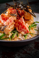 shrimp poke with rice and vegetables in bowl