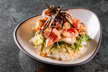 shrimp poke with rice and vegetables in bowl