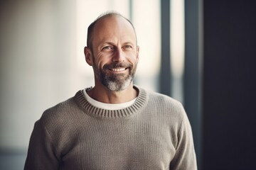 Obraz premium Portrait of a handsome middle-aged man in a sweater.