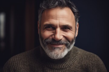 Obraz premium Close up portrait of a handsome mature man with grey hair and beard.
