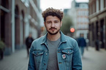 young handsome hipster man outdoors in the city, lifestyle people concept