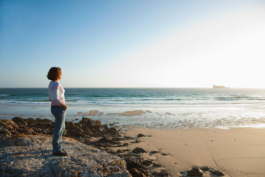 Woman Looking into the Distance at the Beach, Camaret-sur-Mer, Crozon Peninsula, Finistere, Brittany, France