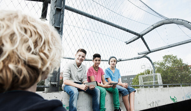 Three Boys and One Girl in Playground, Mannheim, Baden-Wurttemberg, Germany