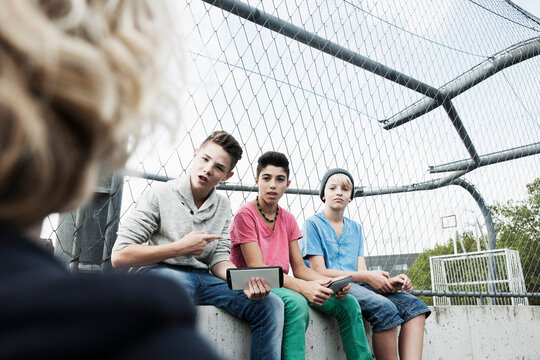 Three Boys and One Girl in Playground, Mannheim, Baden-Wurttemberg, Germany