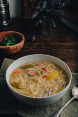Bowl of Noodle Soup with Vegetables and Duck