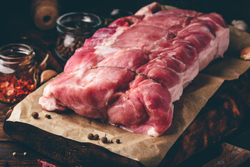 Raw pork loin joint with different spices