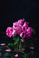 Small pink garden roses in vase