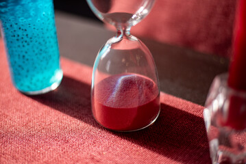 hourglass on red background