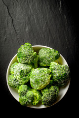 Frozen broccoli in white bowl - 591634806