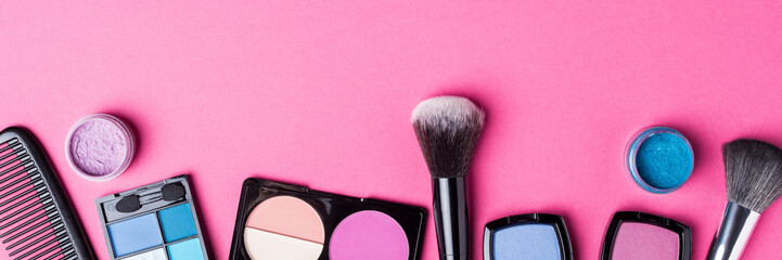 Makeup products on pink background. Top view - 591634824