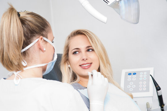 Young Woman at Dentist's Office for Appointment, Germany