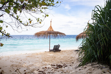 beach chairs on beautiful tropical beach