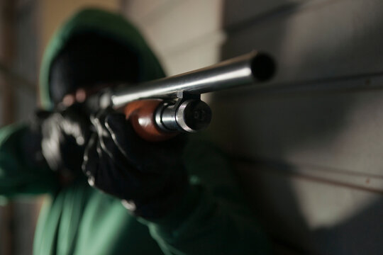 Man Aiming Shotgun, Mannheim, Baden-Wurttemberg, Germany