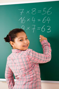 Girl Answering Question at Blackboard in Classroom, Baden-Wurttemberg, Germany