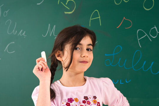 Girl Answering Question at Blackboard in Classroom, Baden-Wurttemberg, Germany