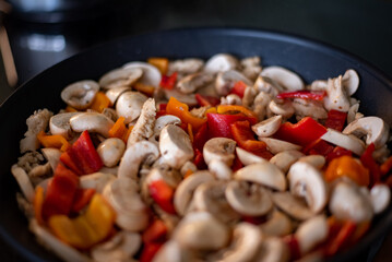 frying pan with meat and vegetables