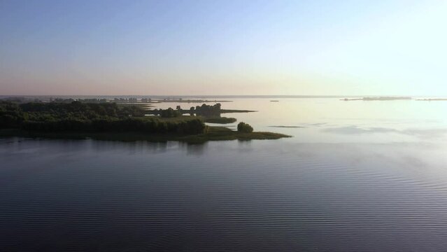 Aerial view to calm river at sunrise