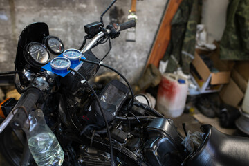 Fototapeta na wymiar motorcycle repair, carburetor throttle synchronization with a vacuum gauge.