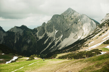 Mature couple hiking in mountains, Tannheim Valley, Austria