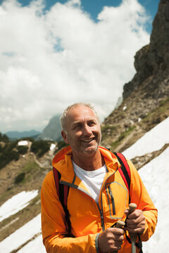 Close-up Portrait of mature man hiking in mountains, Tannheim Valley, Austria