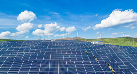 solar energy panels and wind turbine. Drone view