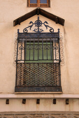 Forged iron grill on window in the old town of Toledo